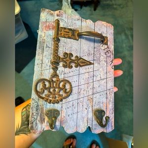 Vintage key wall decor with hooks on it